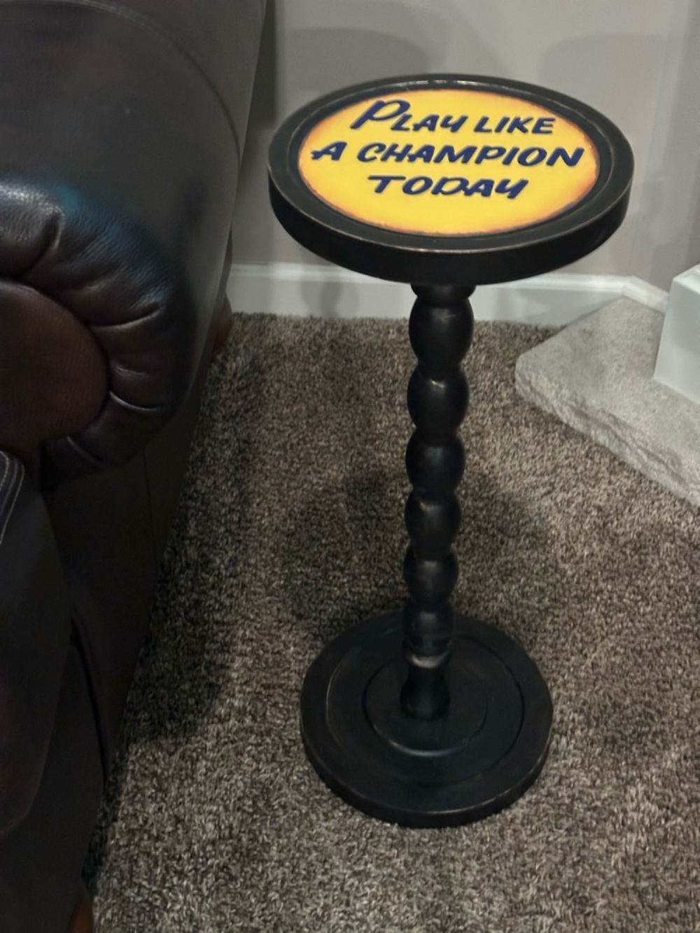 Round Accent Side Table with Yellow 'Play Like a Champion Today' Top